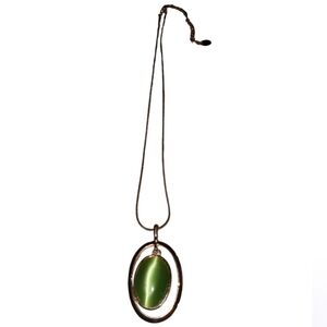 Claire's silver necklace with a green cat's eye pendant